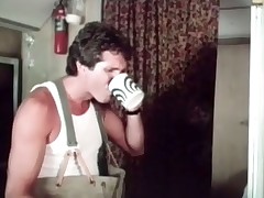 A guy is enjoying a cup of coffee when his girlfriend comes in. She drops her bath robe and gets down on her knees to give him a blow job and then they fuck together on the bed, making their camper shake.