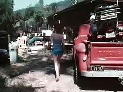 A girl arrives at a garage looking for her boyfriend. This babe starts having a quarrel with him, warning him to stay off the other girls. The both of them fight and she bites his hand. Then he licks her pussy and fucks her.