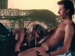 A golden-haired stewardess walks into the cockpit of a plane to bring the pilot some coffee. A little later they are both half naked and she is giving him a blow job. That guy then licks her hairy pussy for a while before he fucks her from behind.